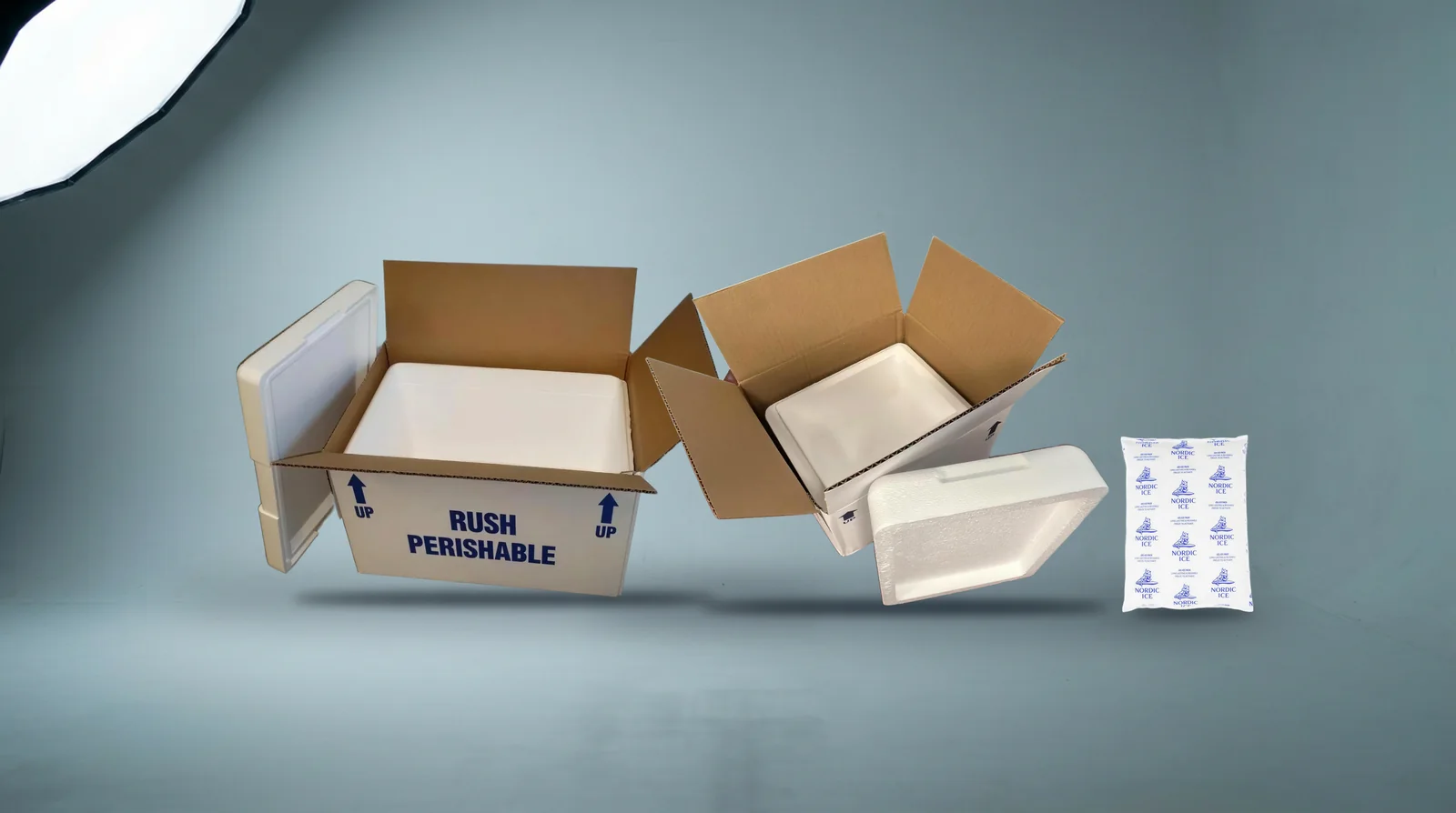 Insulated shipping coolers and a reusable gel pack photographed together in the studio