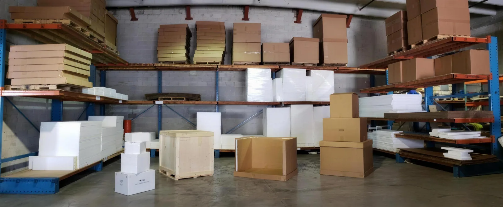 Sub-Zero Dry Ice warehouse stocked with insulated coolers and shipping cartons